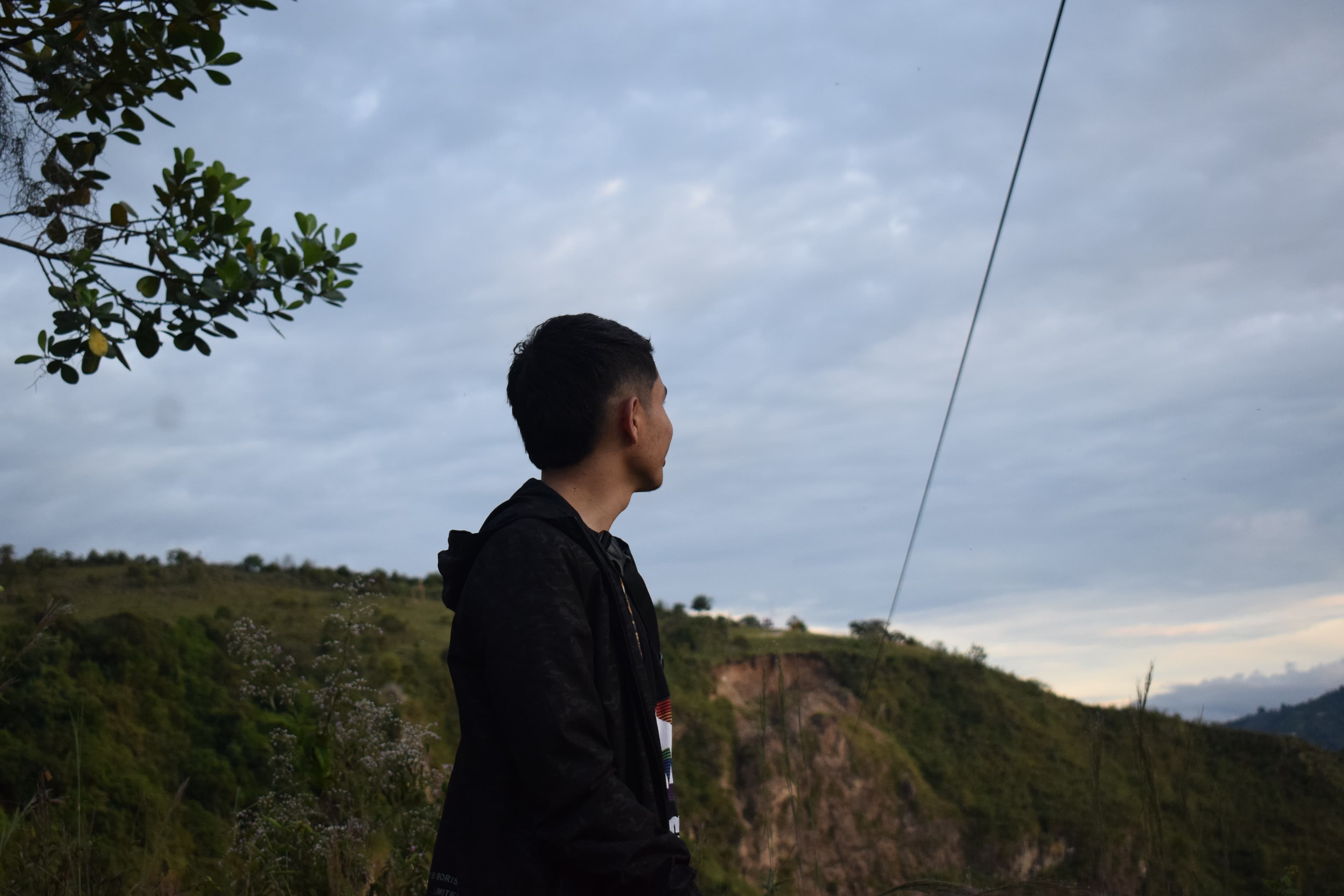 A man looking out over a beautiful landscape.